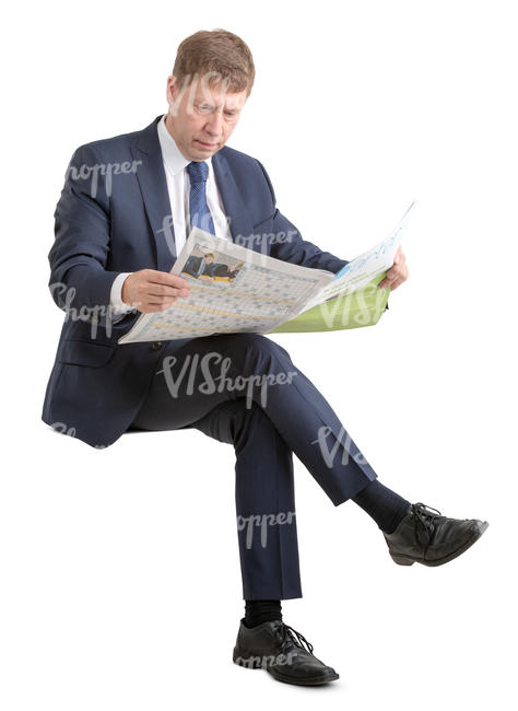 businessman in suit sitting and reading