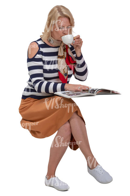woman drinking coffee and reading a magazine