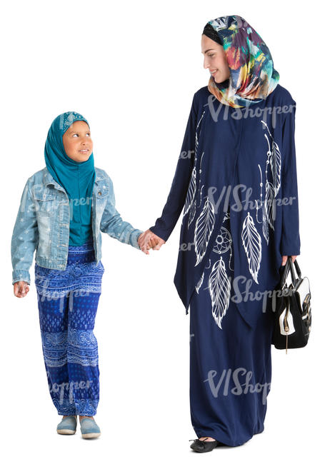 muslim woman walking with her daughter hand in hand