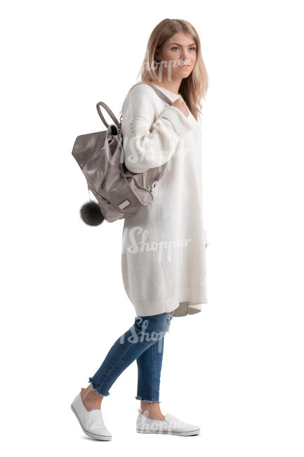 woman in a white sweater walking