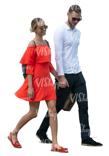 smiling couple walking hand in hand