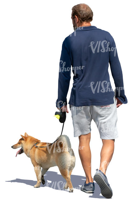 man walking a dog in the summer
