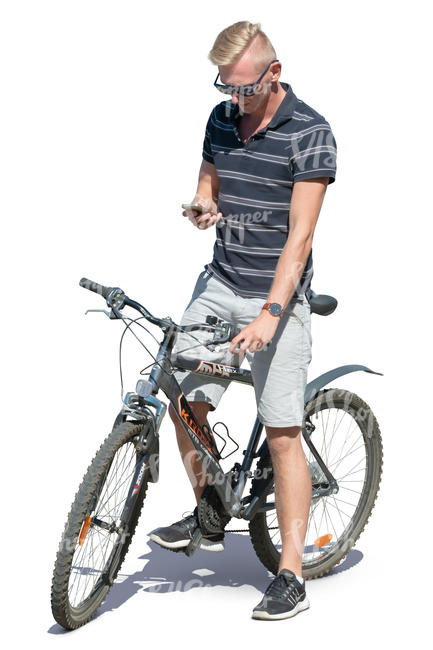 man with a bicycle standing and checking his phone