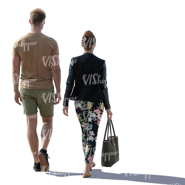 backlit man and woman walking