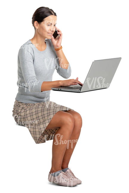 woman sitting at an office desk and working with a computer