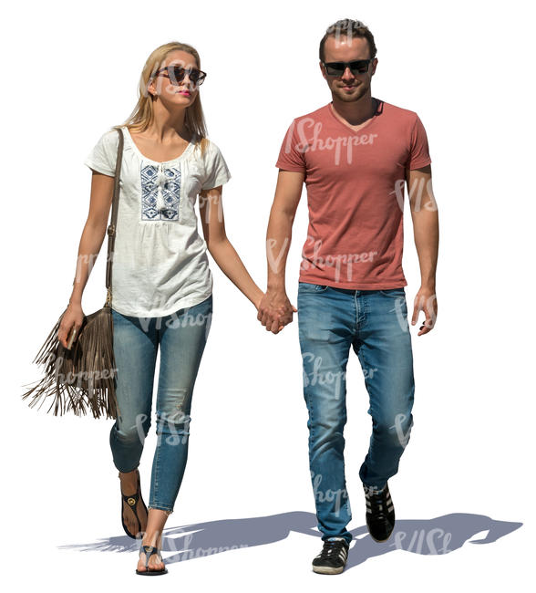 couple walking hand in hand on a sunny day