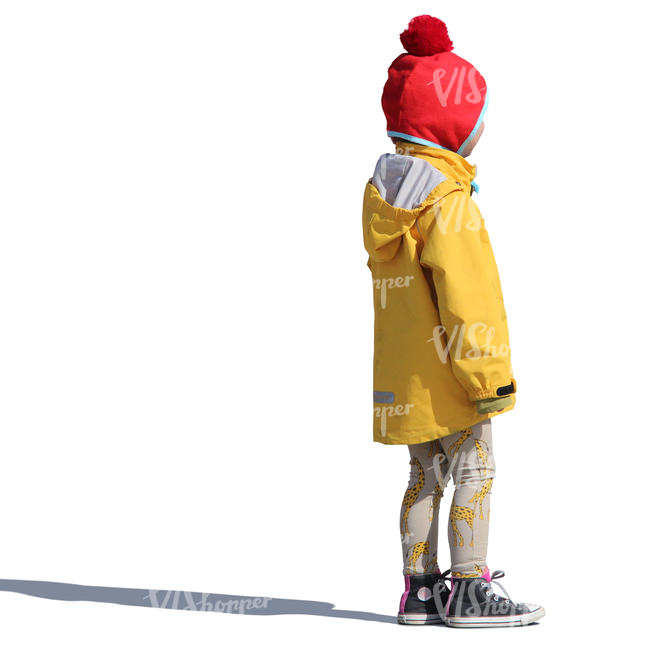 young girl in a yellow raincoat standing
