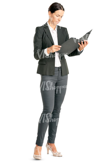 businesswoman standing and looking at some papers
