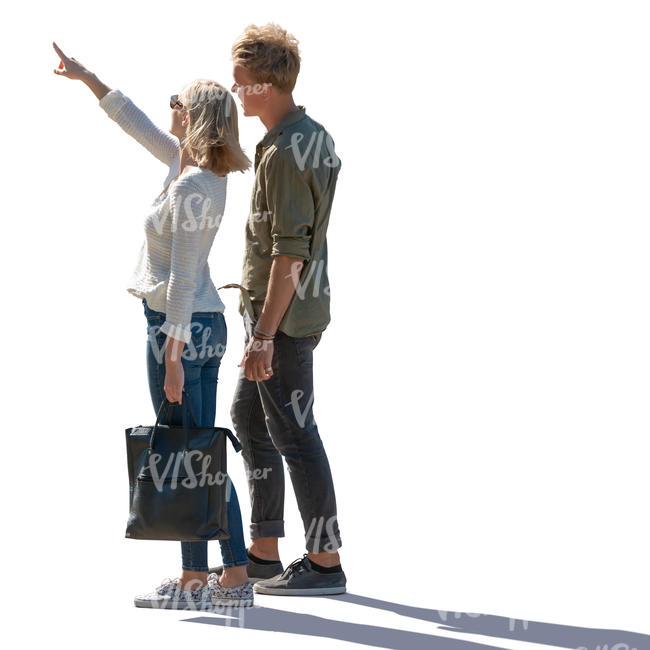 backlit man and woman standing and pointing at smth