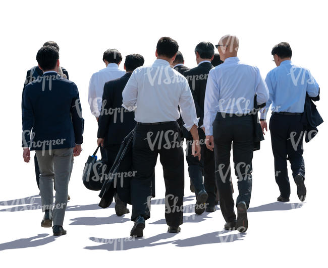 backlit group of businessmen walking