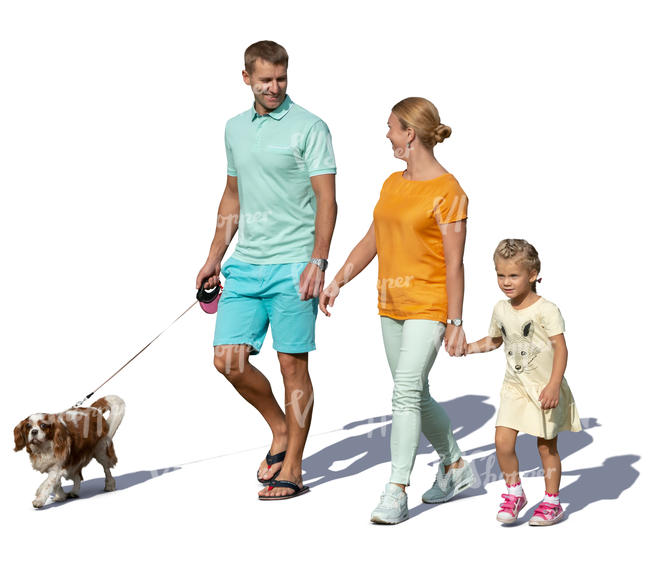 family with a dog walking hand in hand