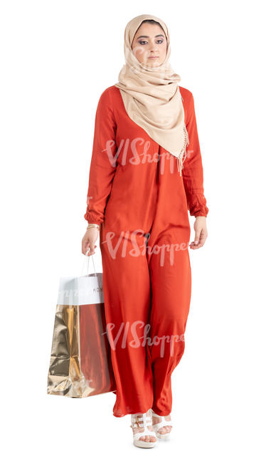 muslim woman in a red abaya shopping