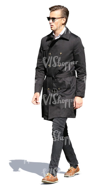man in a black autumn coat walking