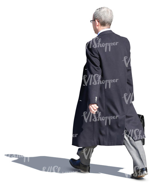 businessman in a black overcoat walking on the street