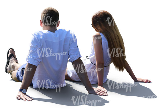 backlit couple sitting on a terrace