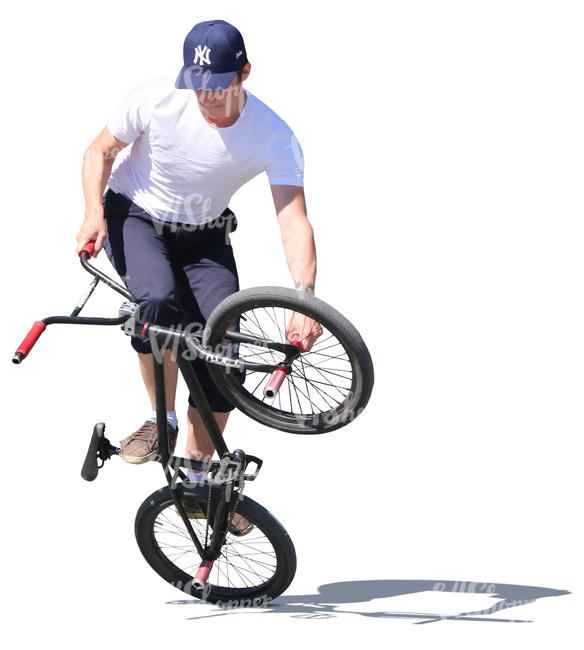 young man doing a bmx trick