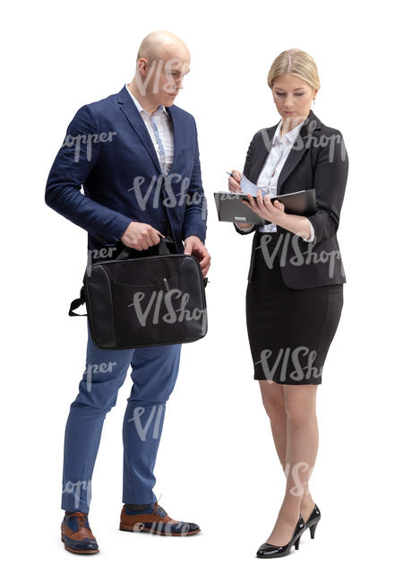 businessman and woman standing and looking at some papers