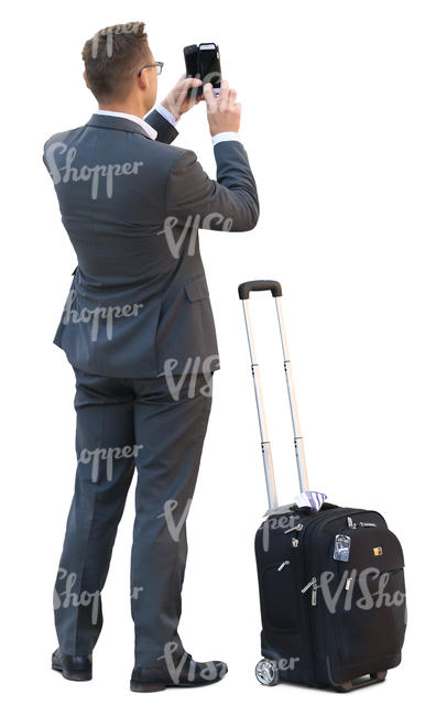 businessman with a suitcase standing and taking a picture