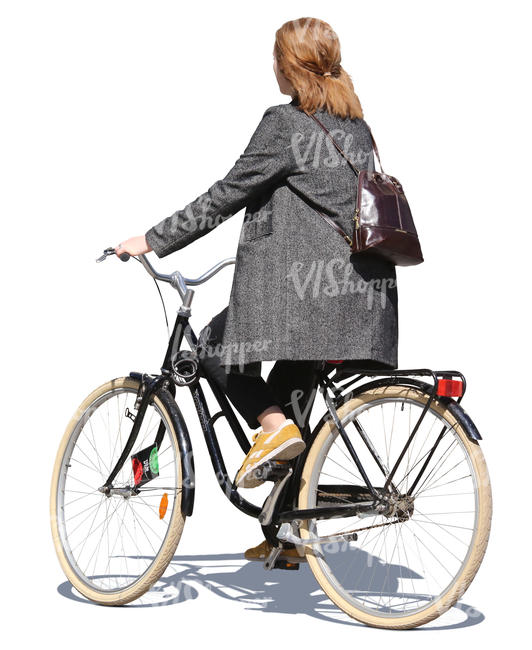 woman in a grey jacket riding a bicycle