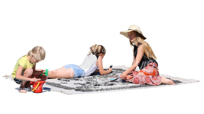 mother with two daughters sitting on a picnic blanket