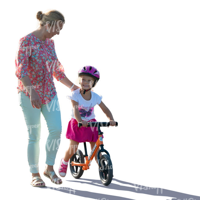 backlit mother and daughter with a likeabike