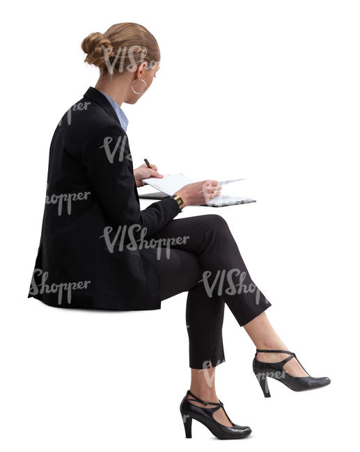 businesswoman sitting and checking her calendar