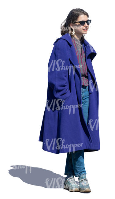 woman in a blue overcoat standing