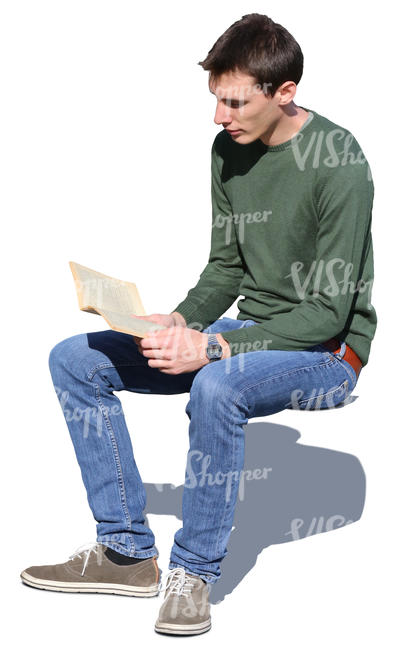 man sitting in the sun and reading a book