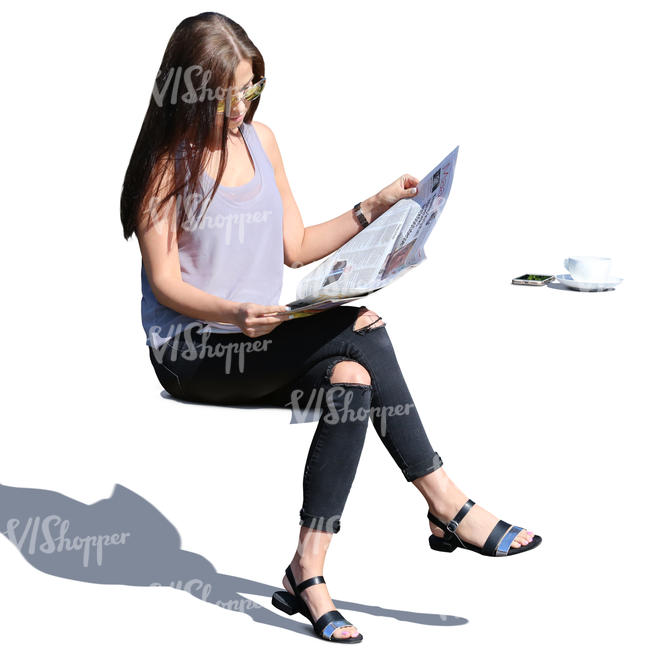 woman sitting in the sun and reading a newspaper