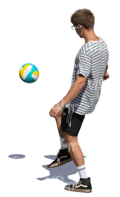 young man juggling a football ball