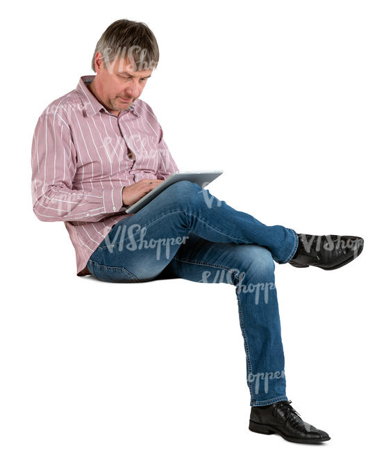 man sitting and working with tablet