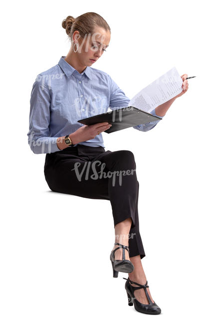 businesswoman sitting and reading some papers