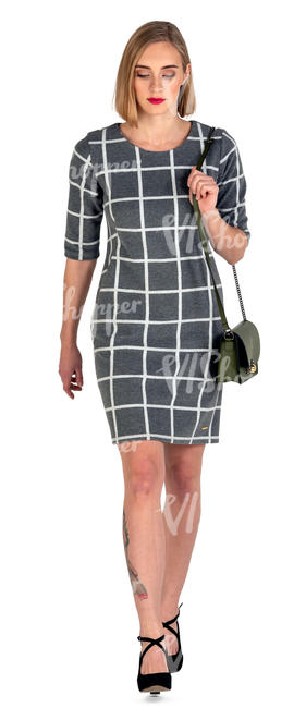 woman in a grey dress walking