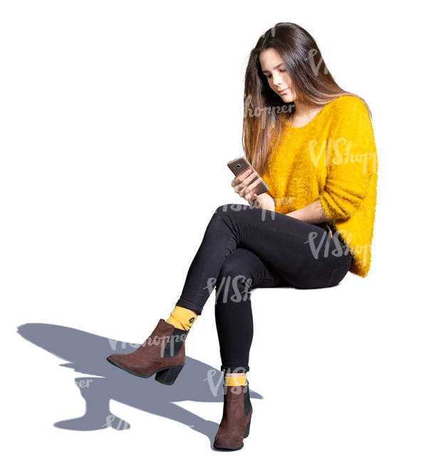 young woman sitting and texting