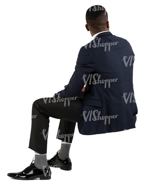 black man in a suit sitting