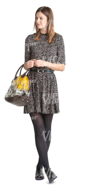 woman in a dress standing and smiling