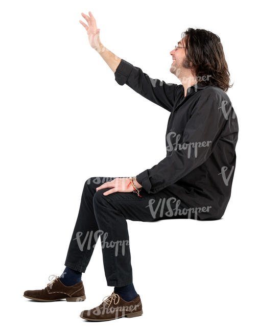 man sitting and waving