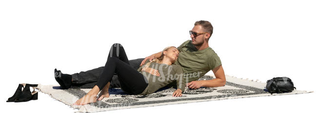 couple lying on a picnic blanket