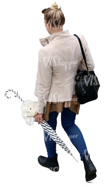 woman walking and carrying an umbrella seen from above