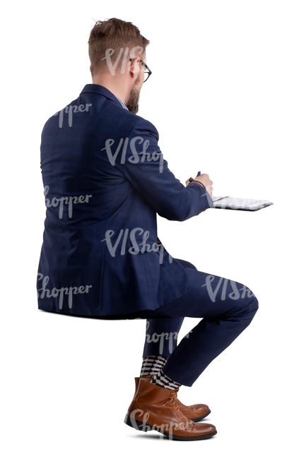 businessman sitting and writing notes