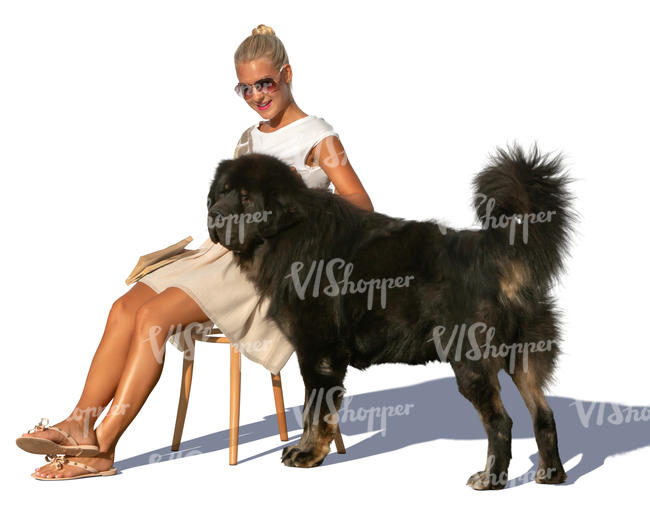 woman sitting and petting her dog