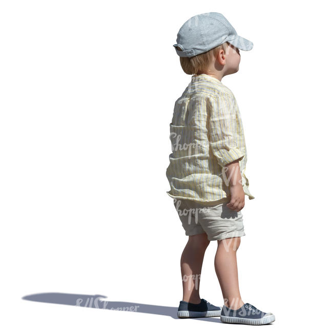 little boy with a baseball cap standing