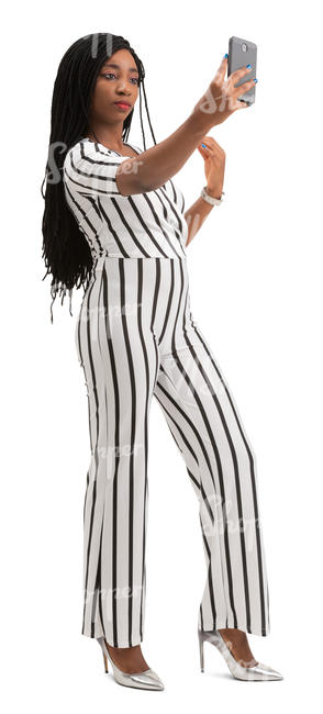 black woman in a striped jumpsuit taking a selfie