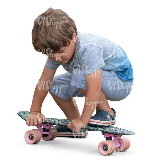 little boy playing with skateboard