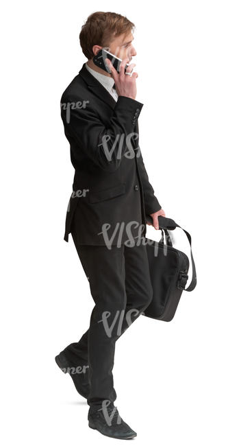 businessman in black suit walking