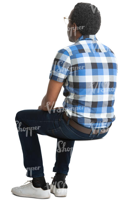 black man in a checkered shirt sitting