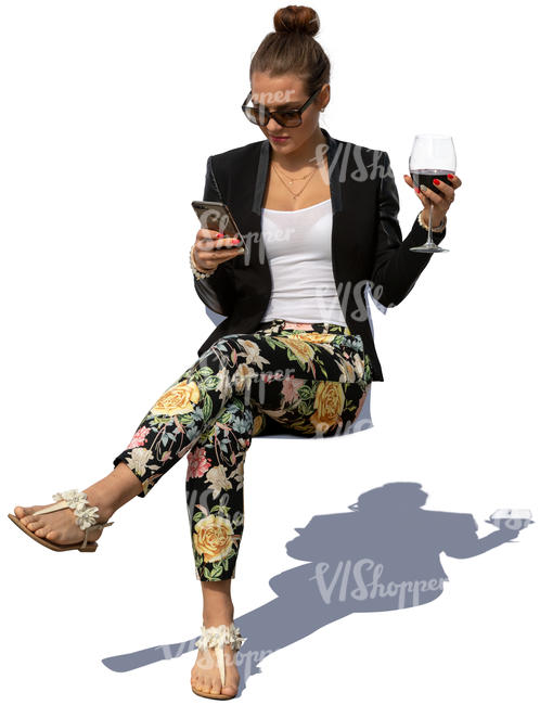 woman sitting and drinking wine