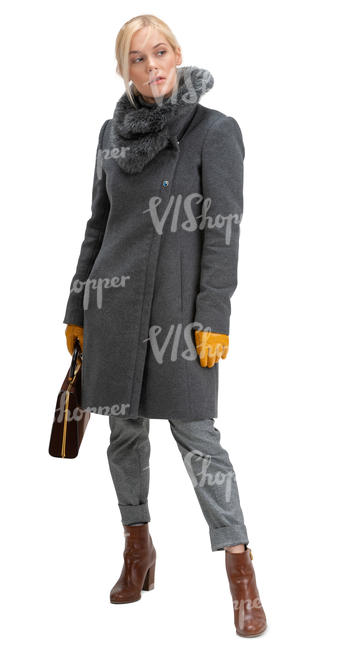 woman in a grey overcoat standing