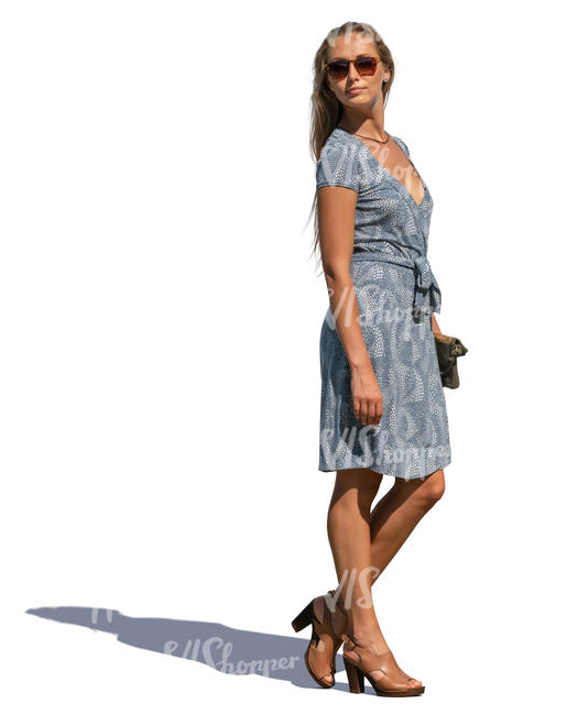 woman in a blue summer dress standing