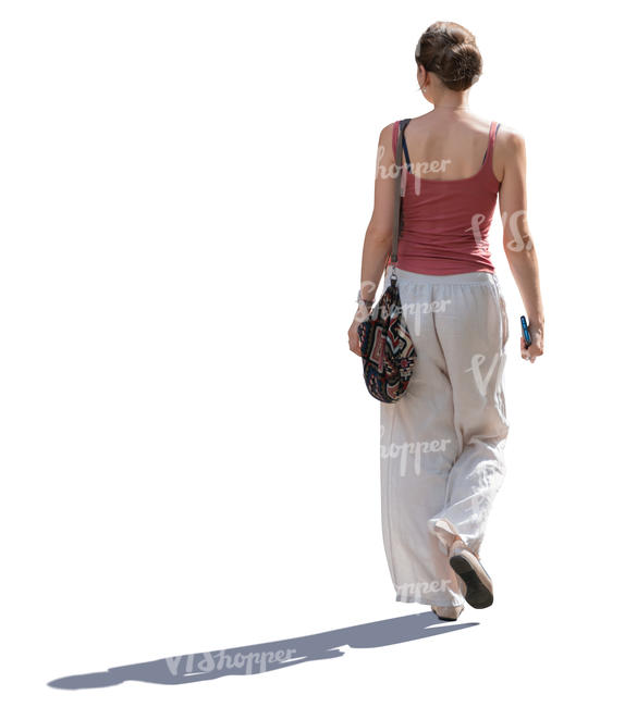 backlit woman walking on a sunny day